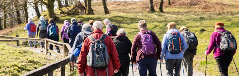 a group of older people on a hike